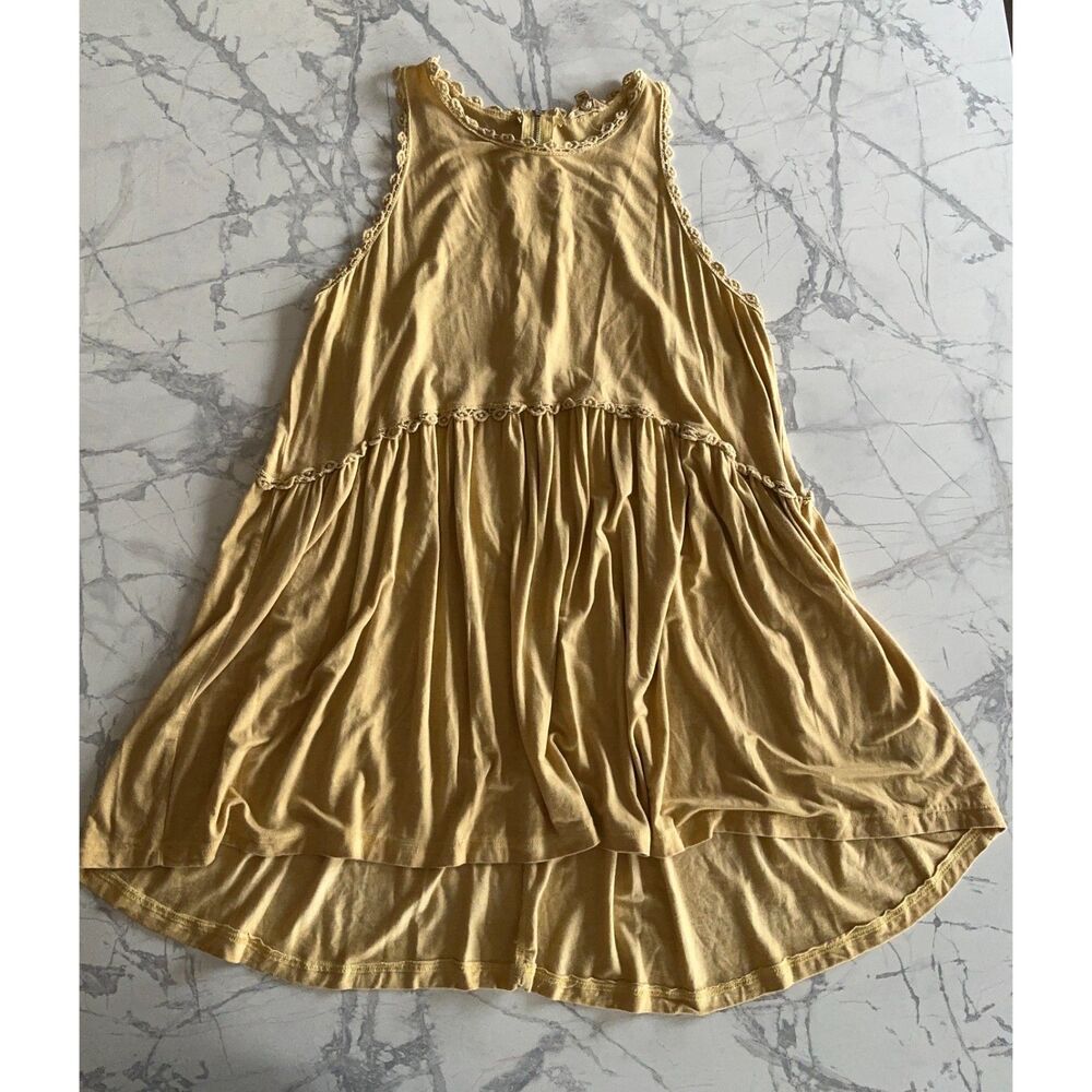 Yellow flowy babydoll tank w/ crochet trim details.